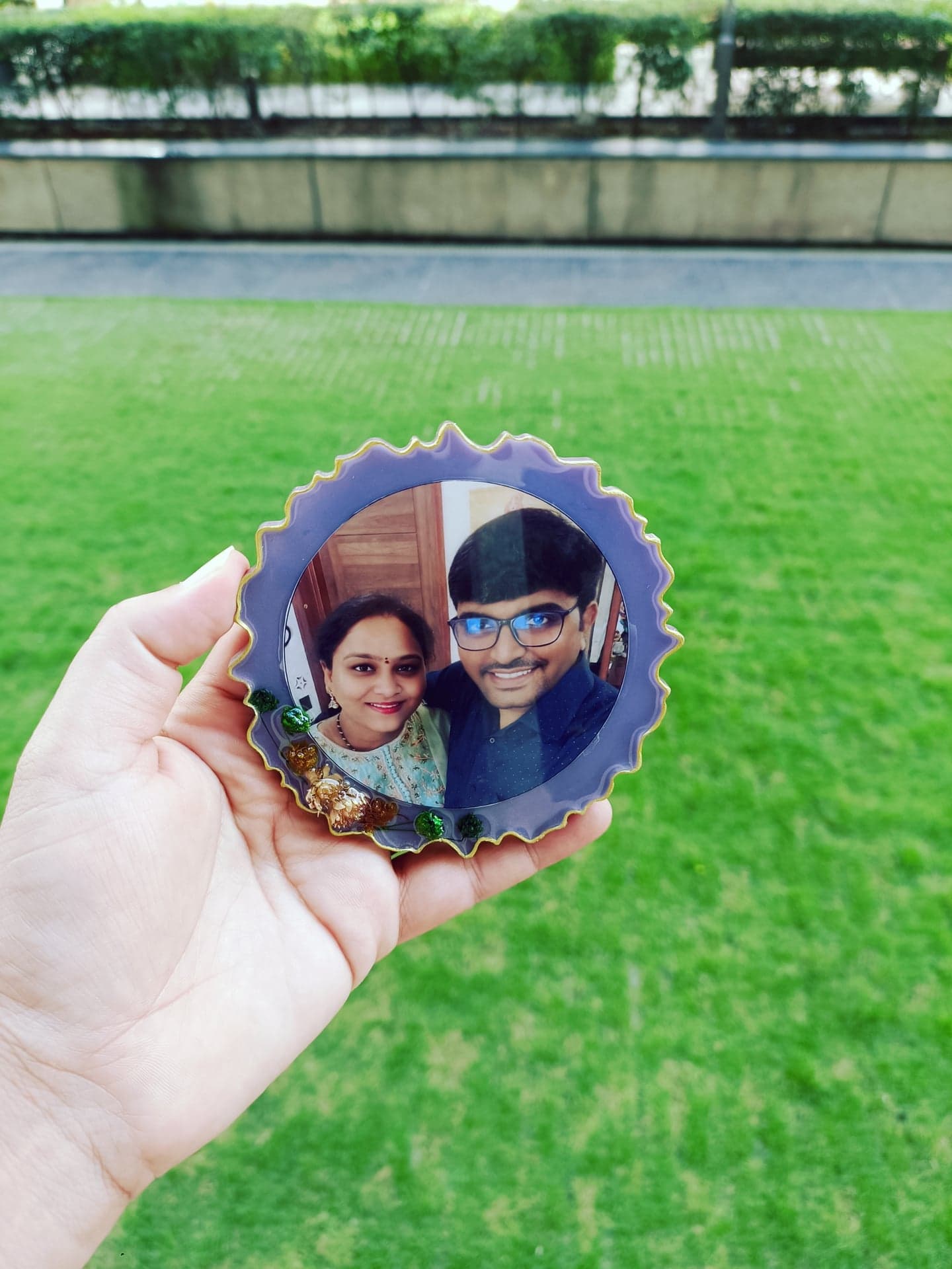 Purple resin magnet with a couple's photograph