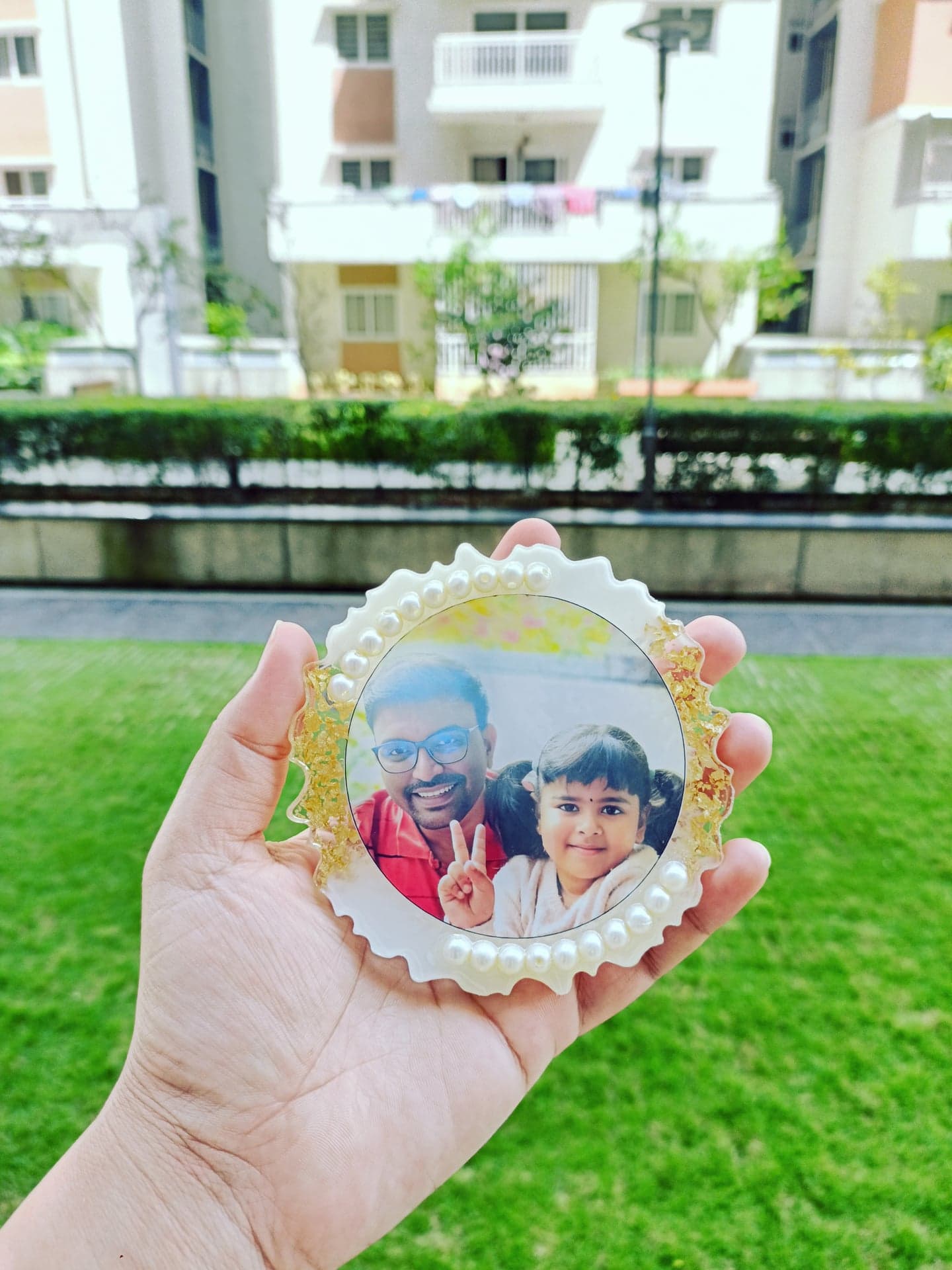 Resin magnet with a father and child photograph, pearls and gold leaf